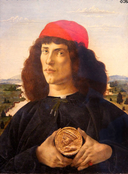 Portrait of a young man with a medal painting (1475-6) by Sandro Botticelli at Uffizi Gallery. Florence, Italy.