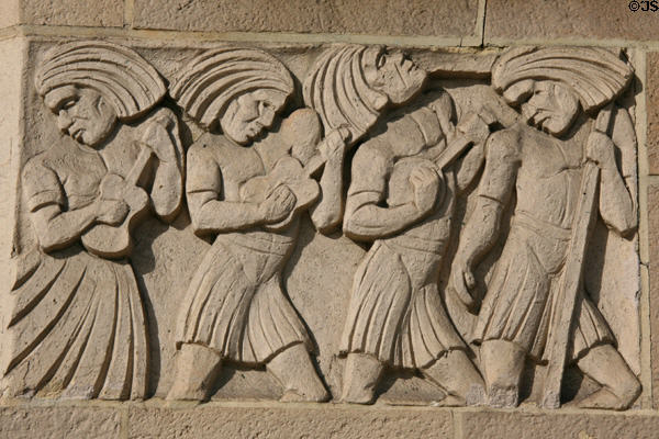 Natives with stringed instruments relief on Gwynn Wilson Student Union at USC. Los Angeles, CA.
