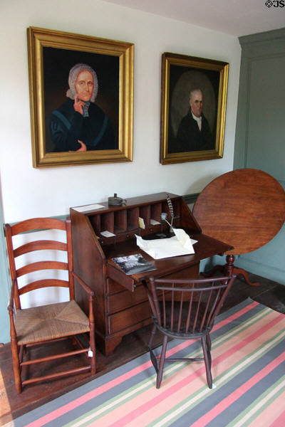 Secretary desk with chairs, tilt table & portraits at Thankful Arnold House. Haddam, CT.