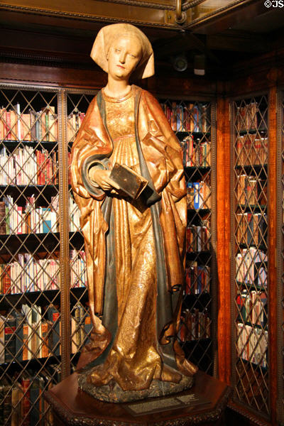 Statue of St Elizabeth holding book (early 16thC) in Antique library at Morgan Library. New York City, NY.