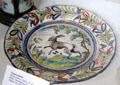 German faience plate painted with leaping rabbit at German Hunting & Fishing Museum. Munich, Germany