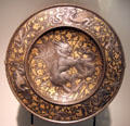 Embossed plate with chimera fighting snake by Elkington Co. of Birmingham at Museum of Decorative Arts. Paris, France.