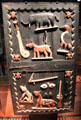 Carved wooden gate of royal palace of king of Glèlè from Abomey, Benin at Musée du quai Branly. Paris, France.