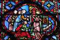 Bowing to Queen on castle stained glass scene at St Chapelle. Paris, France.