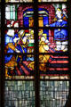 Scene with saint in stained-glass windows at St Joan of Arc Church. Rouen, France.