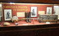 Ed Schieffelin, founder of Tombstone & discoverer of its first silver mine, display with photos, rifle, trunk, boots & canteen at Tombstone Courthouse Museum. Tombstone, AZ.