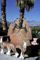 Bench with camel shapes at Palm Springs tourist office. CA