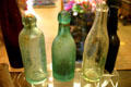 Antique glass soda bottles in Casa de Aguirre museum in Old Town. San Diego, CA.
