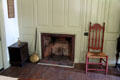 Fireplace & side chair with painted wood paneling at Phelps-Hathaway House. Suffield, CT.