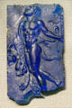 Roman cast glass plaque with satyr carrying body of lion at Corning Museum of Glass. Corning, NY.
