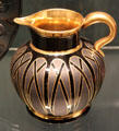Gilded black Hyalith glass jug by glassworks of count of Buquoy of Southern Bohemia at Corning Museum of Glass. Corning, NY.
