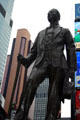 George M. Cohan statue by George John Lober surveys Broadway he made famous. New York, NY.