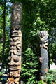 Totem poles by Duane Pasco in Occidental Park of Pioneer Square historic district. Seattle, WA.