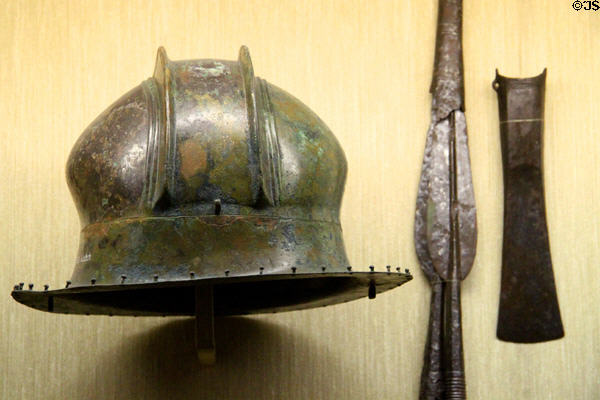 Early iron age helmet, spear points & axe at Museum of Natural History. Vienna, Austria.