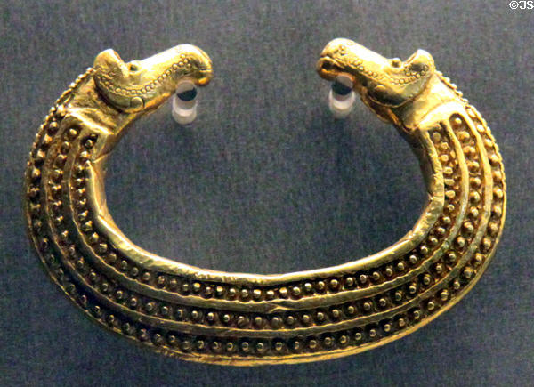 Ancient gold jewelry with two horses heads from Romania at Museum of Natural History. Vienna, Austria.