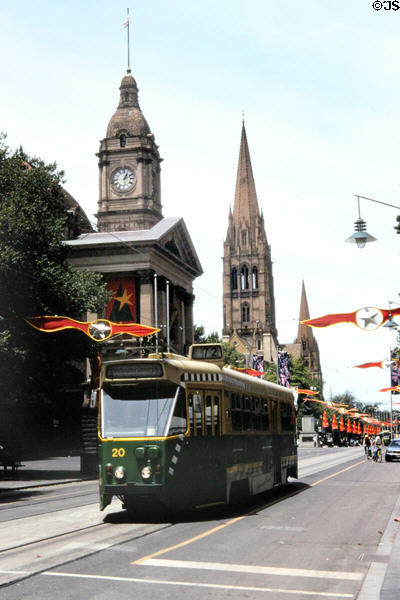 Streetcar in front of Melbourne Town Hall with St Paul's Cathedral beyond. Melbourne, Australia.