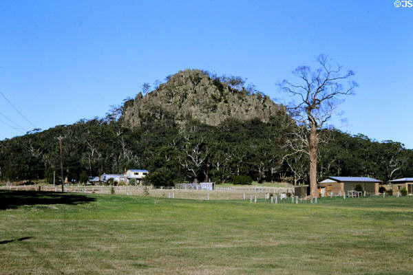 Hanging rock juts out of a forest of trees just outside Melbourne. Australia.