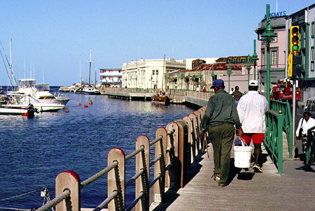Along the wharf at the mouth of the Constitution River. Bridgetown, Barbados.