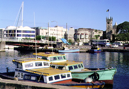 Looking across Inner Basin to Parliament where early bridges gave the Barbadian capital its name. Bridgetown, Barbados.