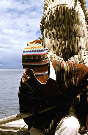 Rower on reed boat at Sun Island. Bolivia.
