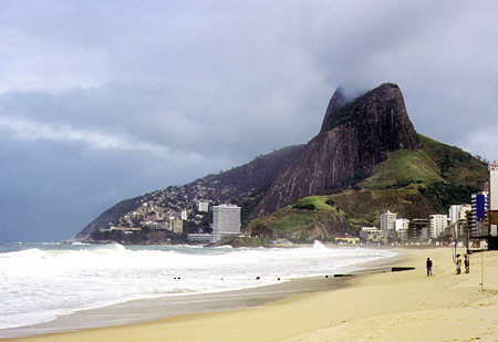 Leblon beach with highrises and typical Rio hills in the distance, Rio de Janeiro. Brazil.