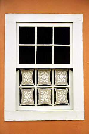 Typical lace window coverings in a home in the village of Tiradentes. Brazil.