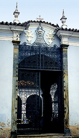 São João del Rei cemetery gate with death head. Brazil.