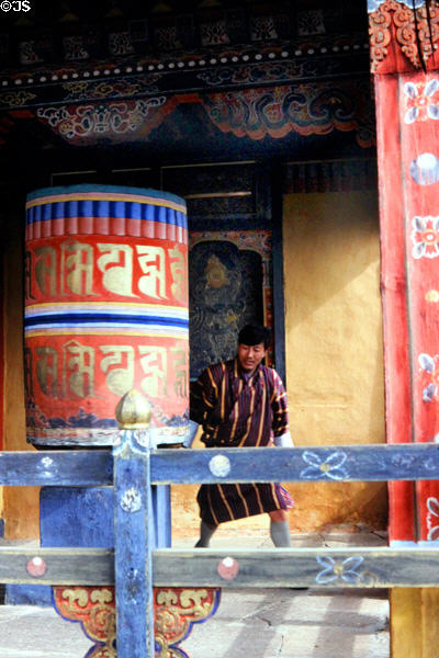 Prayer wheel in use in Paro's national museum. Bhutan.