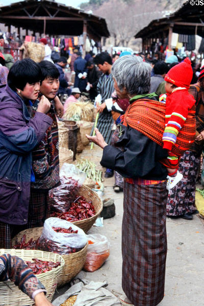 Women converse at Saturday market in Thimpu. Bhutan.