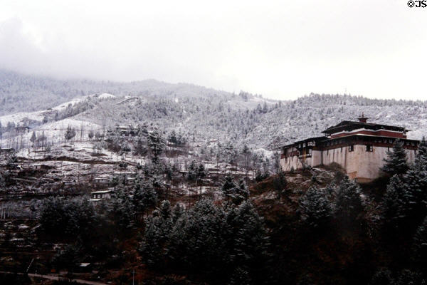 Simtakha Dzong in snow on way to Dochu La Pass. Bhutan.