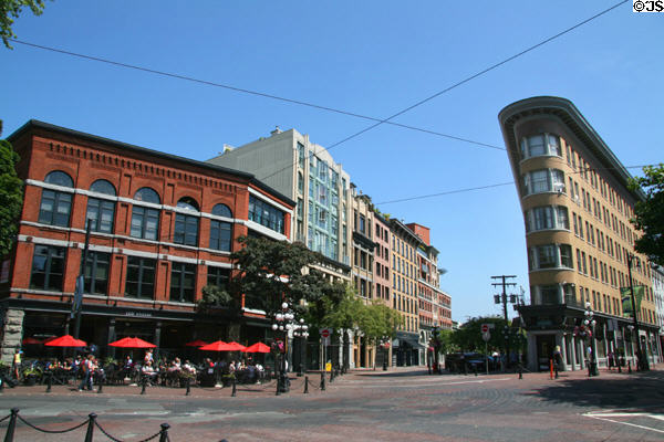 Gastown at Powell & Alexander Sts. with Dunn, Captain French & Europe Hotel buildings. Vancouver, BC.