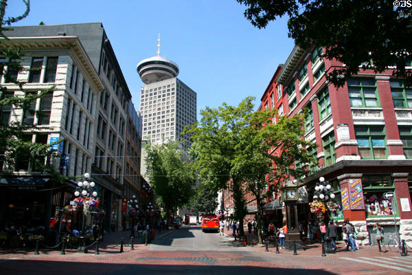 View up Water St. in Gastown to heritage buildings & Harbour Centre. Vancouver, BC.