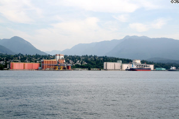 Bulk commodity silos & ship carriers of North Vancouver. Vancouver, BC.
