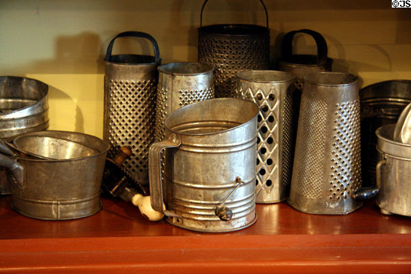 Antique tin kitchen implements in heritage general store at Burnaby Village Museum. Burnaby, BC.
