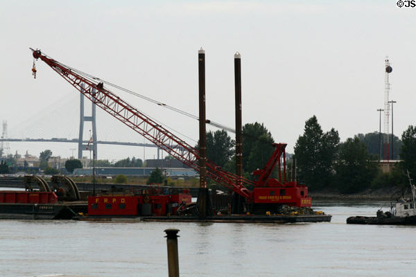 Pile driving & dredging operation barge on Fraser River. New Westminster, BC.
