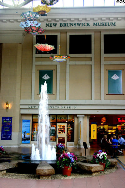 New Brunswick Museum entrance with inverted umbrellas over fountain. Saint John, NB.