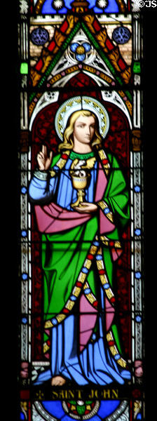 Stained glass Saint John with chalice & serpent in Christ Church Cathedral. Fredericton, NB.