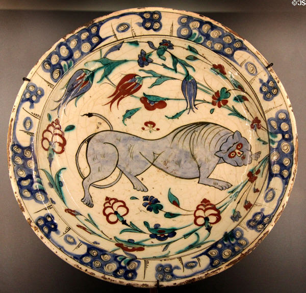 Fritware dish painted with lion & flowers (17thC) from Iznik, Turkey at Aga Khan Museum. Toronto, ON.