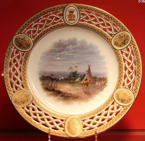 Porcelain dessert plate with scene Camp on Eagle River - Expecting the Crees (c1867) by Minton of Stoke-on-Trent, England at Gardiner Museum. Toronto, ON.