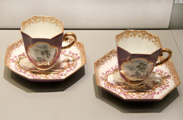 Meissen porcelain coffee cups & saucers decorated with European scenes in white quatrefoils (c1735) at Gardiner Museum. Toronto, ON.