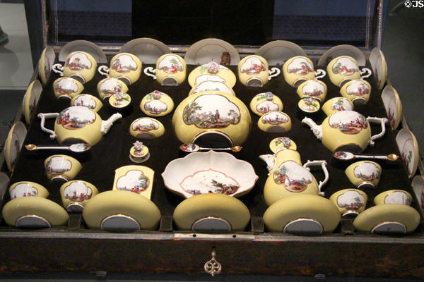 Meissen porcelain tea & chocolate service decorated in yellow with European scenes in white quatrefoils in original case (c1740-45) at Gardiner Museum. Toronto, ON.