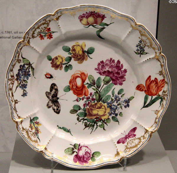 Porcelain plate painted with flowers & butterflies from Hof service (c1765) attrib. Joseph Zachenberger for Nymphenburg of Munich, Germany at Gardiner Museum. Toronto, ON.