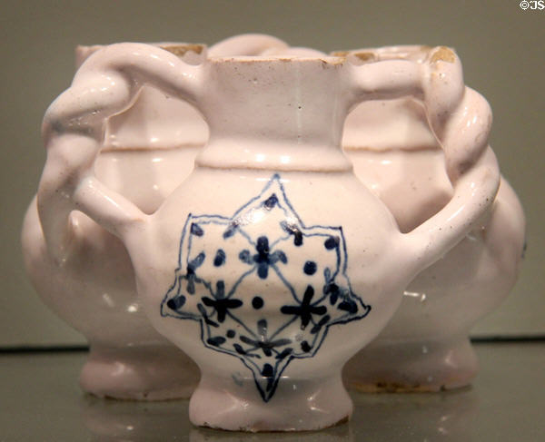 Fuddling cup with blue star on white English delftware (1639) from. London at Gardiner Museum. Toronto, ON.