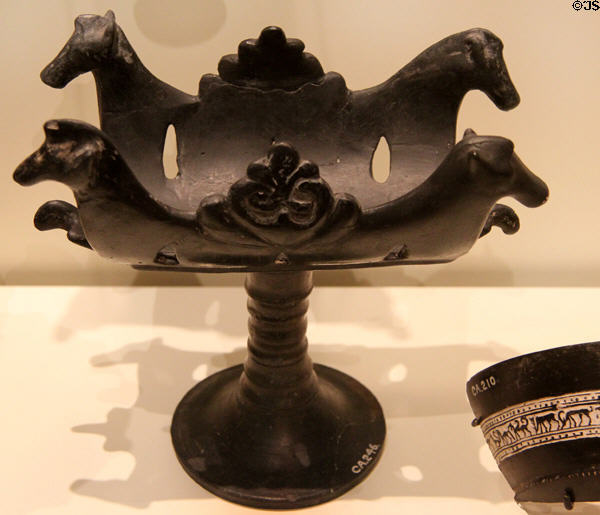 Etruscan black ceramic Bucchero Ware stand with profile of horses (550-500 BCE) at Royal Ontario Museum. Toronto, ON.