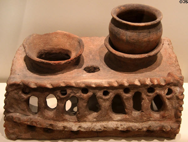Etruscan clay portable stove with supports for two cooking pots (600-500 BCE) at Royal Ontario Museum. Toronto, ON.