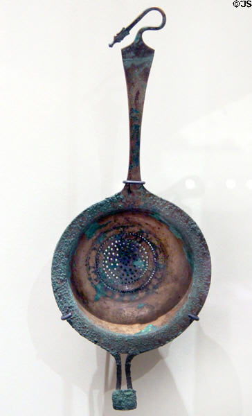 Etruscan bronze wine strainer with snake at end of handle (c325-275 BCE) at Royal Ontario Museum. Toronto, ON.