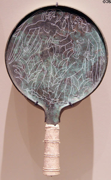 Etruscan bronze mirror back (c300 BCE) depicting pair of Lasa goddesses of fate each holding an alabastron at Royal Ontario Museum. Toronto, ON.