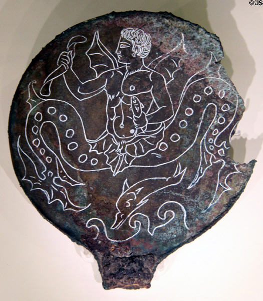 Etruscan bronze mirror back (c300-250 BCE) depicting giant sea creatures at Royal Ontario Museum. Toronto, ON.