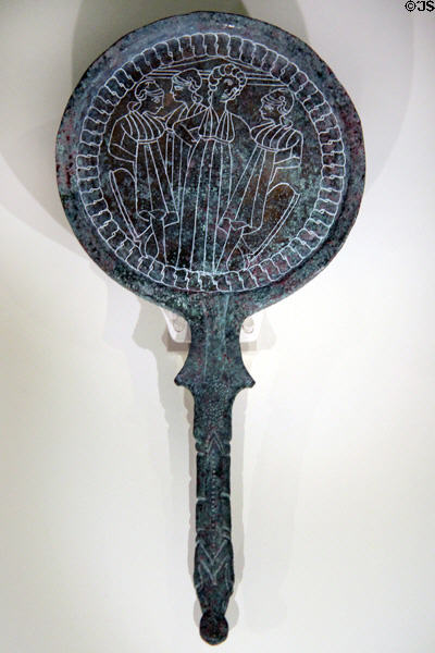 Etruscan bronze mirror back (c300-200 BCE) depicting Castor & Pollux flanked by female deities at Royal Ontario Museum. Toronto, ON.