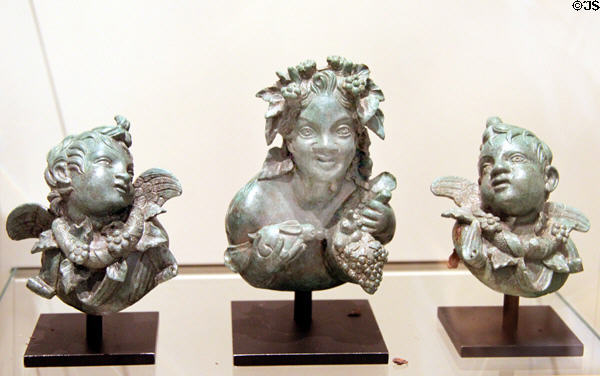 Roman bronze furniture appliqués with Satyr & Cupids (25 BCE - 25 CE) from Rome at Royal Ontario Museum. Toronto, ON.